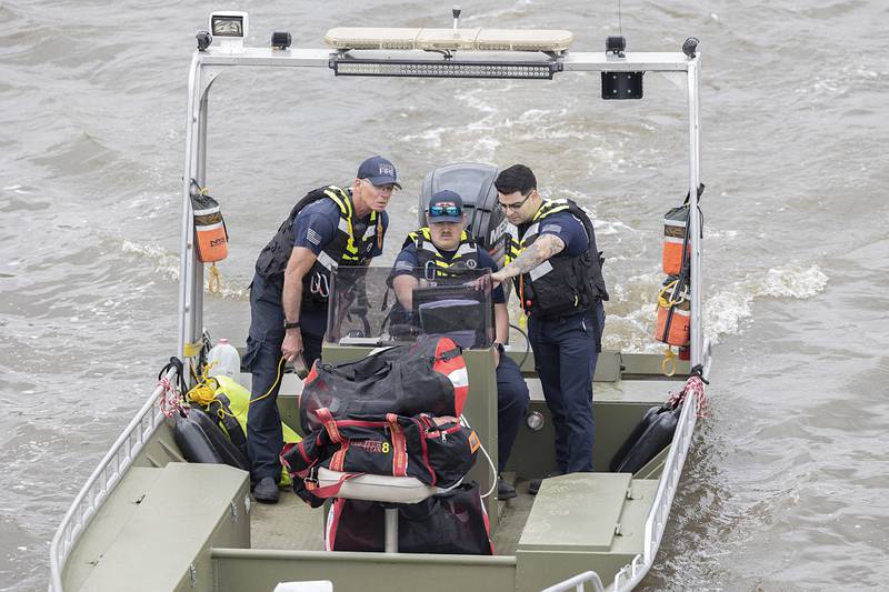 Oregon Fire Department members check a sonar in Dixon Tuesday, April 14, 2026, after an individual jumped over the railing off of the Peoria Avenue Bridge late Monday night.
