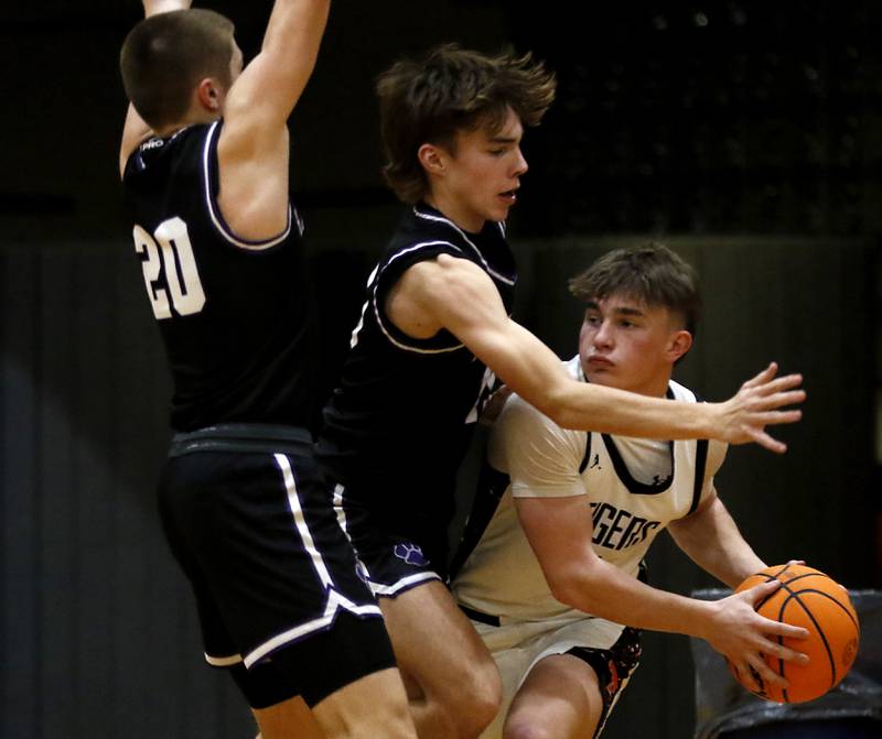 Hampshire's Ryan Prowicz (left) and Hampshire's Eli Schol (center) pressure Crystal Lake Central's Carter Kelley, (right) during a a Fox Valley Conference basketball game on Friday, Feb. 7, 2025, at Crystal Lake Central High School.