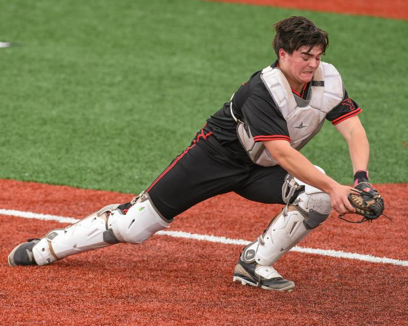 Yorkville's Bryce Baxa (24) tries to make a play at home but was unsuccessful allowing Romeoville to score a run during the regional game on Thursday May 29, 2025, held at Yorkville High School.