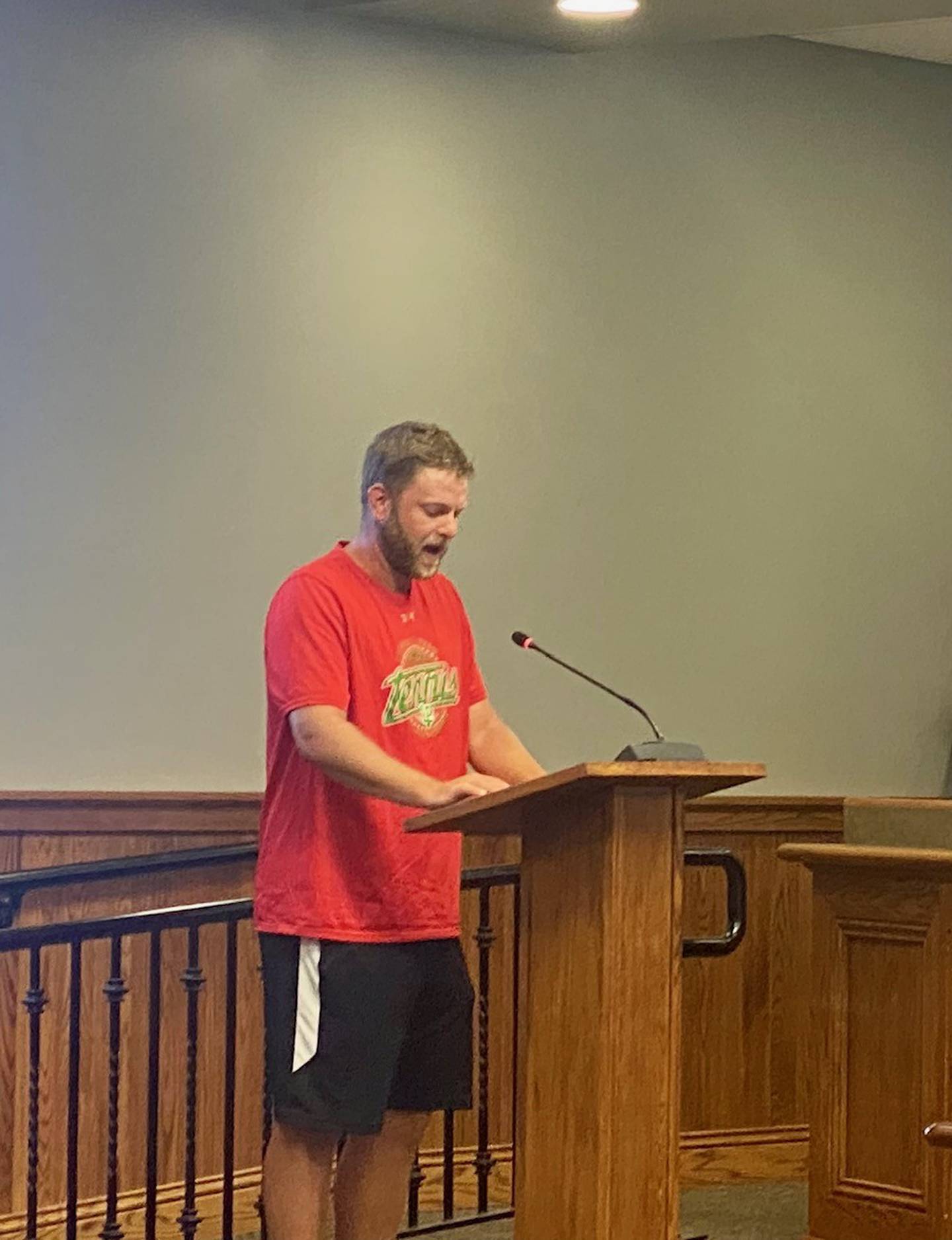 La Salle- Peru High School Head Tennis Coach, Aaron Guenther speaks during Peru's committee meeting on Monday.