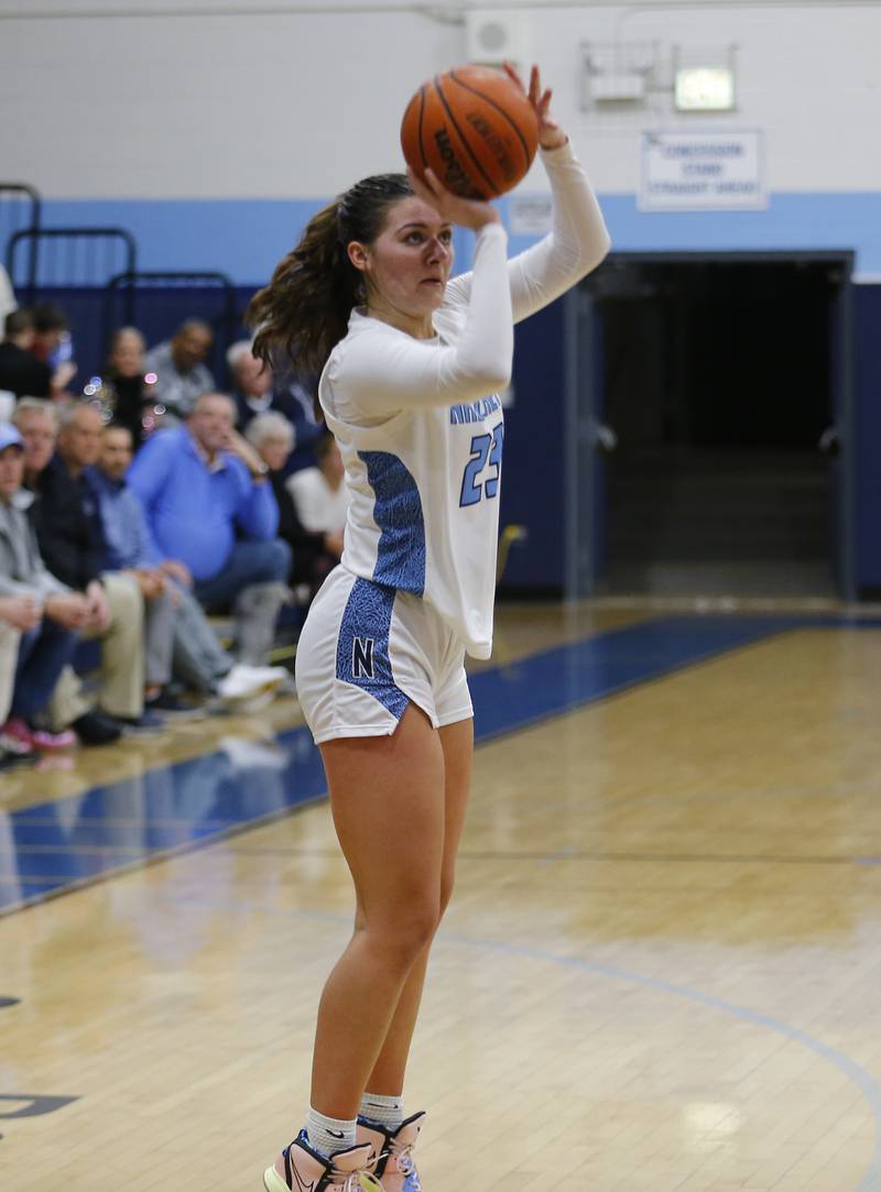 Nazareth's Danielle Scully (23) puts up a shot during the girls varsity basketball game between Carmel High School and Nazareth Academy on Wednesday, Dec. 7, 2022 in LaGrange, IL.