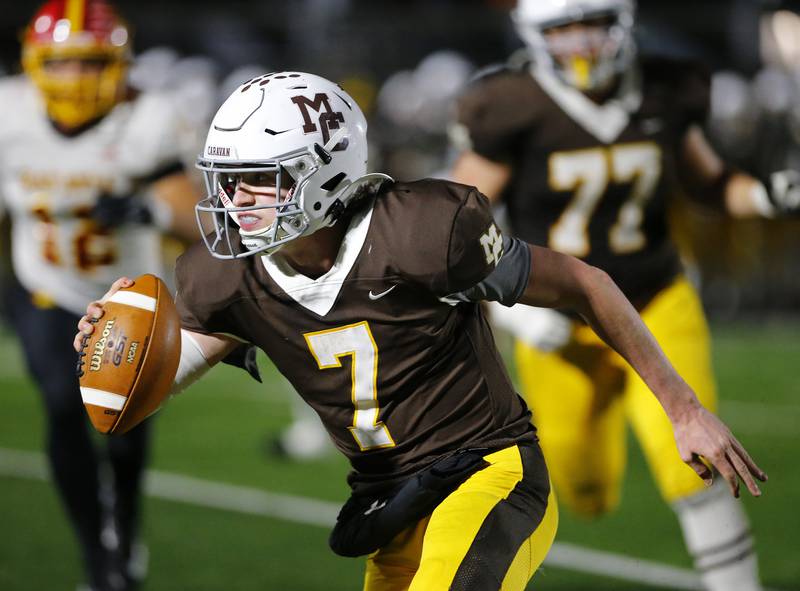 Mt. Carmel's Blainey Dowling scrambles with the ball during the IHSA Class 7A  varsity football playoff game between Batavia and Mt. Carmel on Friday, November 5, 2021 in Chicago.