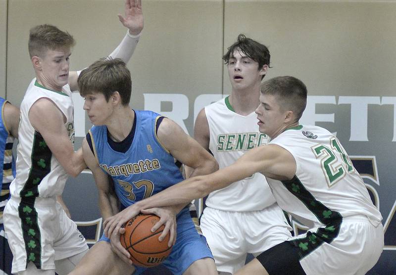 Seneca’s Paxton Giertz and Lane Provance block passing lanes for Marquette’s Charlie Mullen (32) during Thursday's Marquette Christmas Tournament championship game in Ottawa.