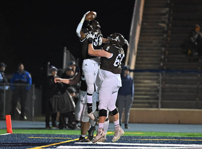 Joliet Catholic's HJ Grigsby (13) celebrates after scoring a touchdown during IHSA Class 4A first round playoff on Friday, Oct. 28, 2022, at Joliet. (Dean Reid for Shaw Media)