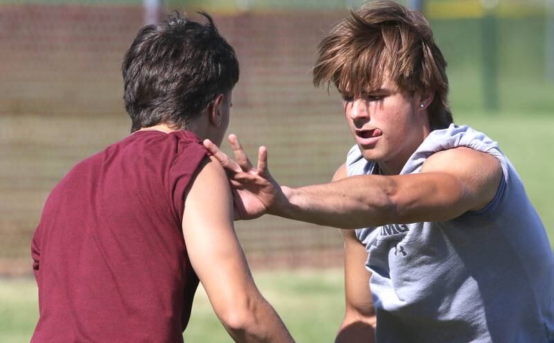 Sycamore's Eli Meier (right) and Addison Peck work through a drill with the defensive backs Monday, June 27, 2022, during football practice at the school.