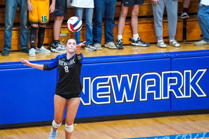 Newark’s Heather Buhle (8) serves the ball during a non-conference match against Aurora Christian at Newark High School on Tuesday, Sept. 9, 2025.