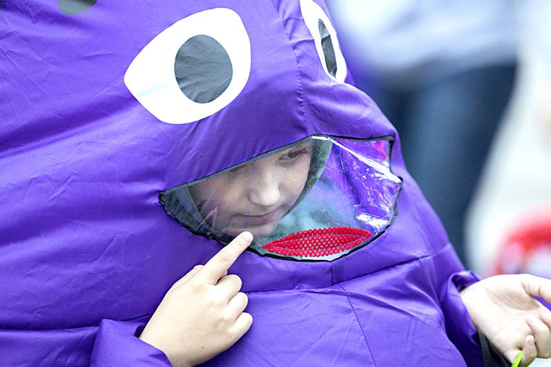 Dressed as Grimace, Graham Bouland, 9, checks out Dixon Washington School’s trunk-or-treat Wednesday, Oct. 25, 2023. The fun event was open to preschool and kindergarten students and their families at the school.