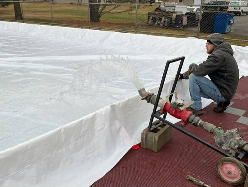 Princeton Park District staff took advantage of the colder Wednesday temperatures as they finished setting and filling up the organization’s portable EZ ice rink located at Alexander Park.