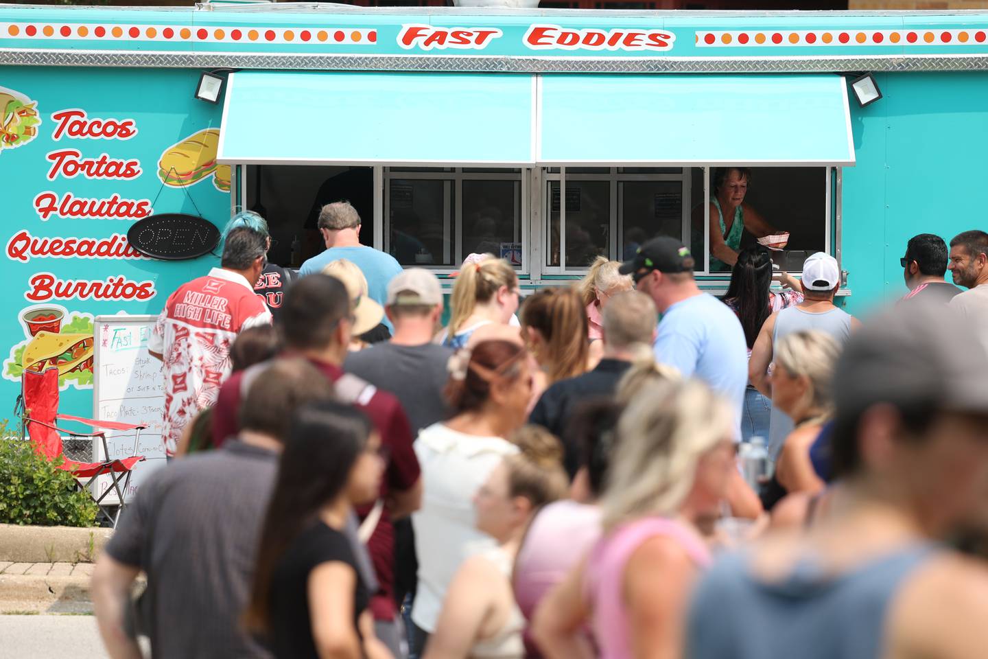 People line up dozens deep at the Fast Eddie’s food truck at Taco Fest on Saturday, July 15th, 2023 in New Lenox.
