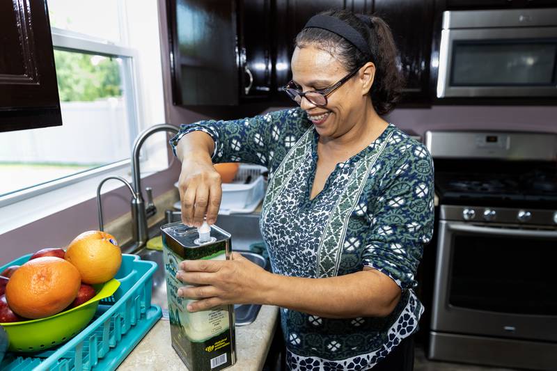 Aicha Kaltsos, who has utilized Northern Illinois Food Bank’s Project DASH program, makes dinner for her family in Joliet on Sept. 17, 2025.