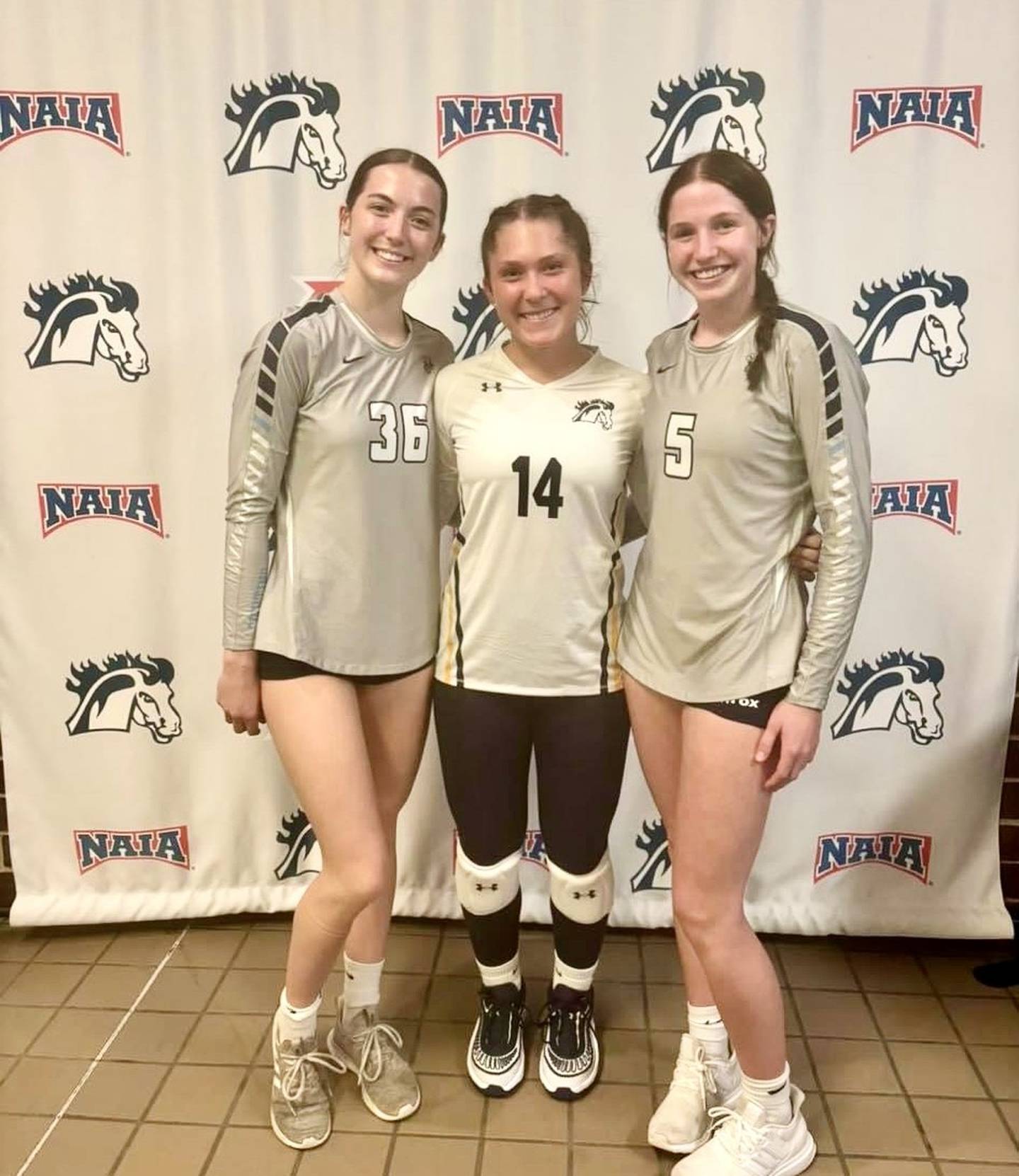 There was a Bureau County reunion in a recent JV match with Princeton's Chrissy Sierens (left) and Bureau Valley's Kate Salisbury (right) suiting up for St. Ambrose University and Princeton's Miyah Fox (center) playing for Mt. Mercy University.