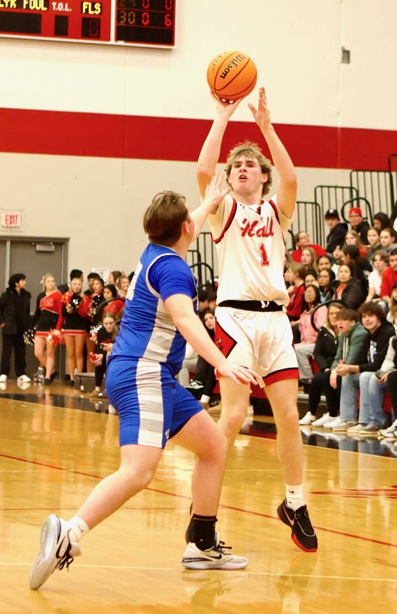 Hall's Wyatt West shoots over Princeton's Jordan Reinhardt Friday night at Hall High School. The Red Devils won 62-54.