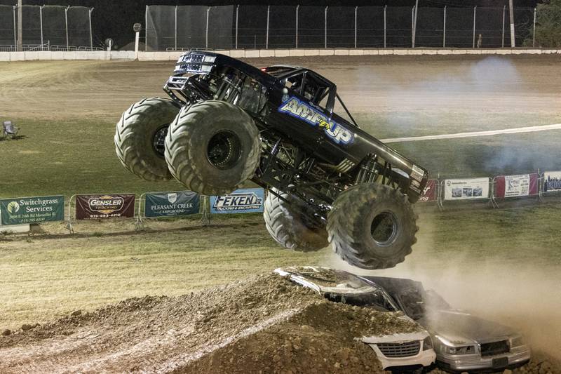 Ralph Holman drives Monster Truck 'Amp'ed Up' as it flies over 2 cars and ramp at the Monster Truck Bash on Saturday, Sept. 13, 2025 at the La Salle Speedway in La Salle.