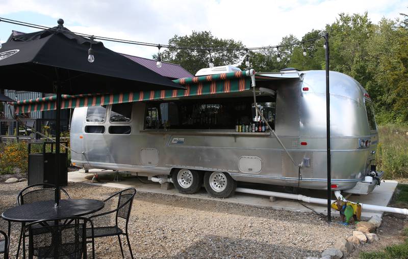 An outdoor Airstream trailer serves beverages and alcohol to guests on Monday, Sept. 18, 2023 at Camp Aramoni.