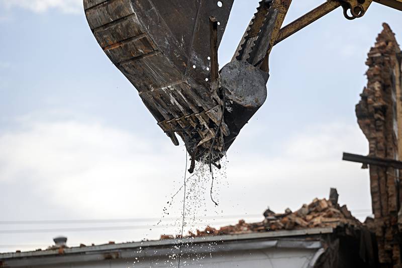 A water heater gives up its good during the demolition Tuesday, Sept. 5, 2023.
