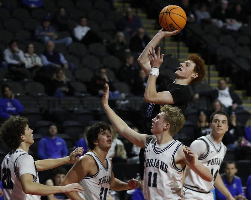Burlington Central's Patrick Shell shoots the ball over the Cary-Grove defense during a Fox Valley Conference basketball game  on Tuesday, Jan. 14, 2025, at Now Arena in Hoffman Estates.