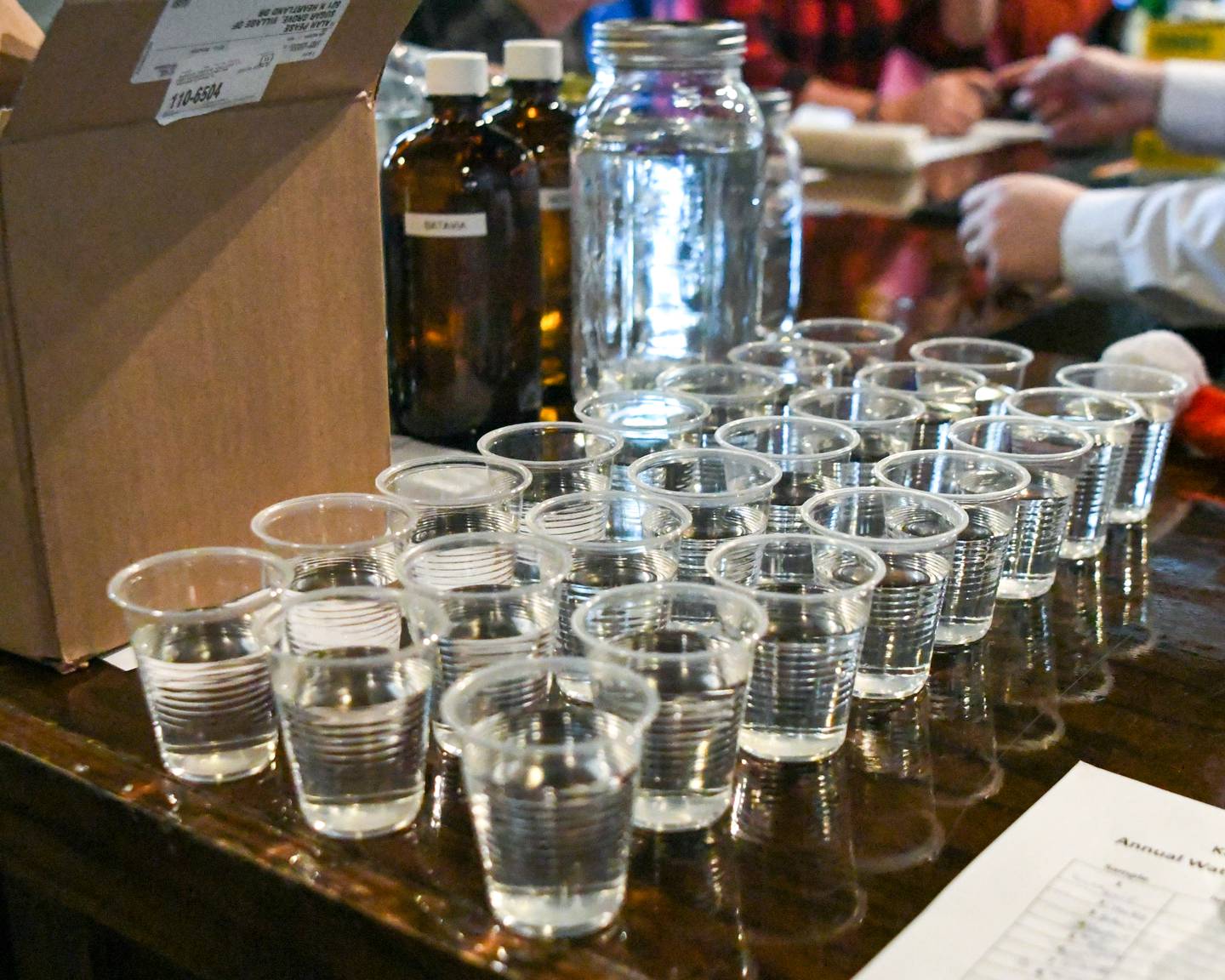 Cups of water are ready to be tasted from nine different city’s that participated from around Kane County on Thursday Dec. 18, 2025, during the annual Kane County Water Association water contest held at the Global Brew Tap House in St. Charles.