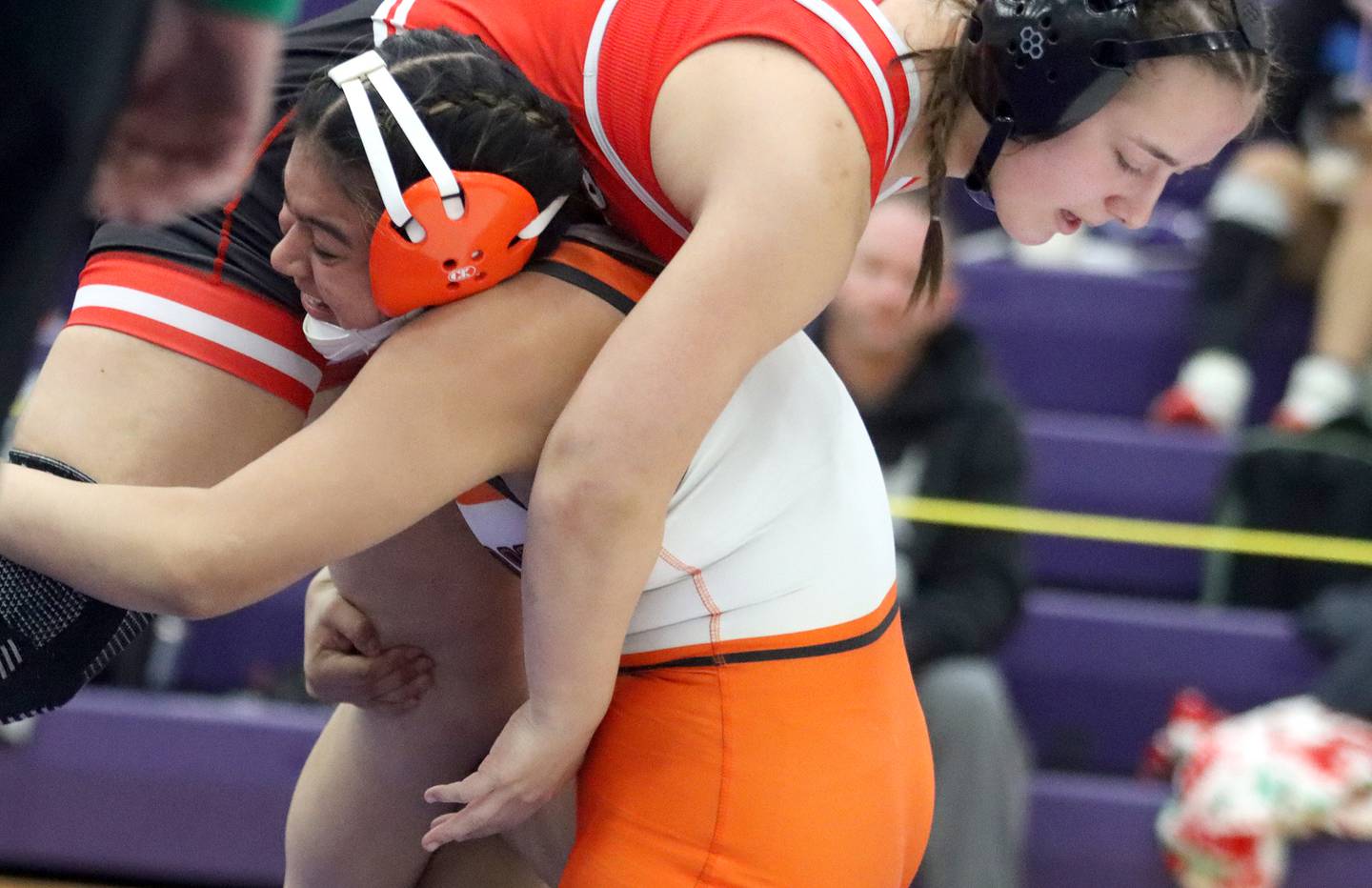 McHenry’s Natalie Corona lifts Barrington’s Nicole Dziura at 140 pounds in IHSA Regional wrestling semifinal action on Saturday, Feb. 1, 2025, at  Hampshire High School  in Hampshire.
