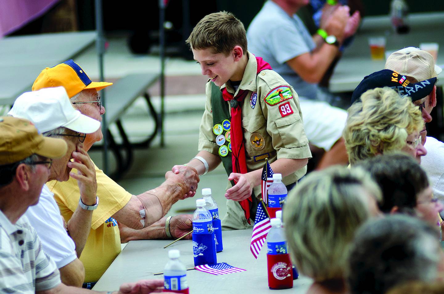 Boy Scout Noah Hage, 12, of Troop 93 was one of several scouts to make his way through the crowd shaking hands and thanking veterans for their service.