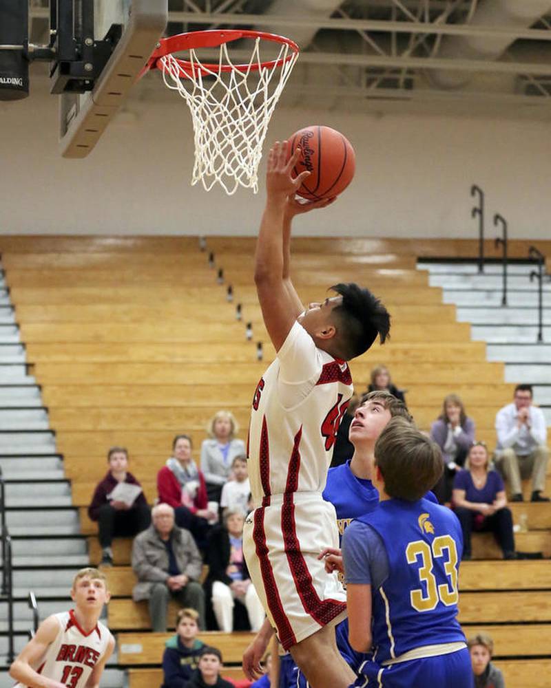 Shabbona's Jorge Loza goes up for two of his team-high nine points Thursday in a 40-27 loss to Wheaton Christian in the IESA Class 8-3A Saratoga Regional championship game.