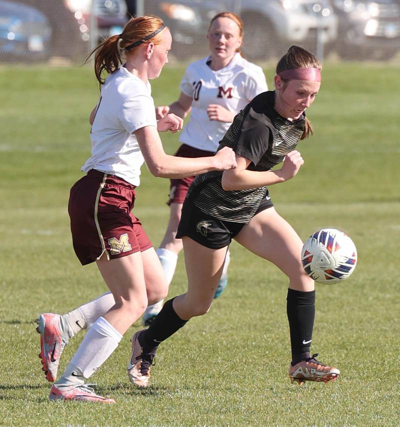 Morris' Makensi Martin (left) and Sycamore's Cortni Kruizenga go after a loose ball during their Interstate 8 Conference Tournament semifinal game Wednesday, May 3, 2023, at Sycamore High School.