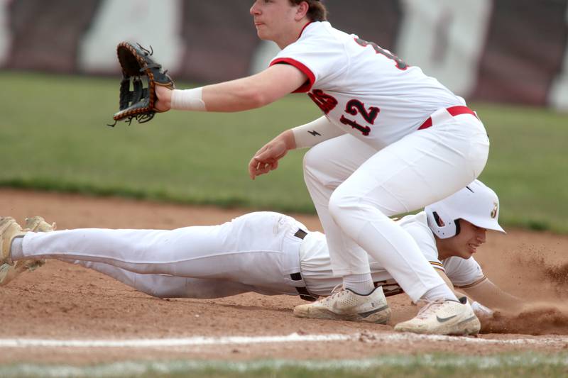 Huntley’s AJ Putty fields a pick-off throw as Jacobs’ Aiden Stumpf scrambles back safely to first base in varsity baseball Wednesday at Huntley.