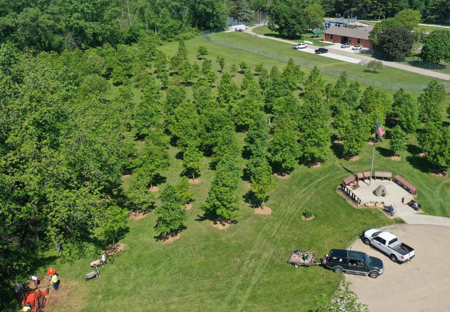Milton Pope students plant mulch around Oak trees on Friday, May 23, 2025 near the Illinois Fallen Soldier Memorial at Illini State Park in Marseilles.