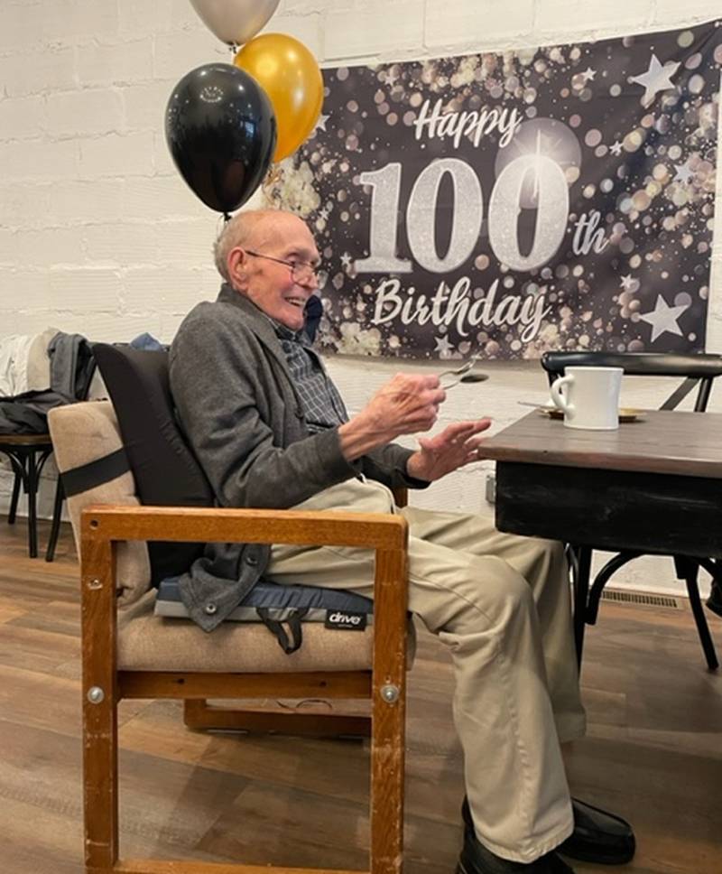 Don Johnson plays spoons at his 100th birthday party with family and friends.