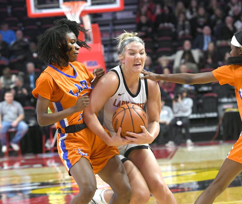 Byron's Ella Grundstrom (13) brings down a rebound against Chicago Noble/Butler in the 2A semifinals in Normal at Redbird Arena on Thursday, March 2 Grundstrom had 14 rebounds and 6 points in Byron's 55-43 victory.