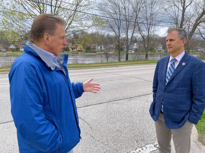 East Dundee Village President Jeff Lynam talks with U.S. Rep. Sean Casten about flooding issues along the Fox River Monday, April 25, 2022. Casten visited East Dundee Monday to hear about flooding issues and other village projects.