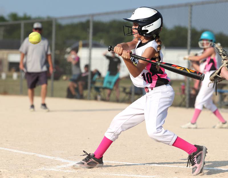 Kishwaukee Valley Storm 10u player Elena Staley takes a cut Wednesday, June 21, 2023, during a scrimmage game against the Poplar Grove Power at the Sycamore Community Sports Complex. The Kishwaukee Valley Storm is hosting the Storm Dayz tournament this weekend which draws about 70 teams and runs Friday through Sunday in Sycamore.