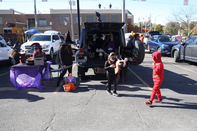 A witch decorated vehicle is one of the candy stops at the Joliet Police Department Trunk-Or-Treat event on Saturday, Oct. 26, 2024 in Joliet.