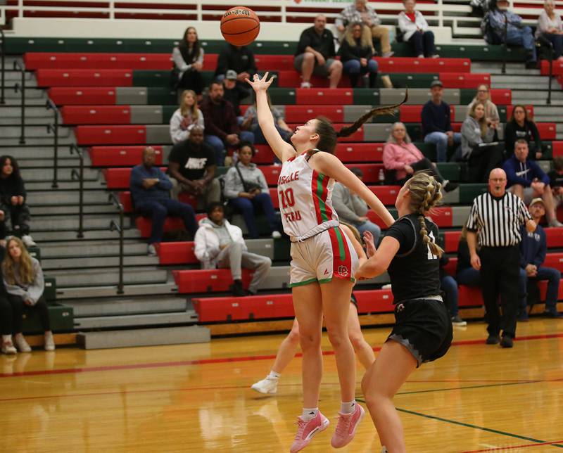 L-P's Bailey Pode reaches out to grab a rebound over Kaneland's Berlyn Ruh on Friday, Dec. 8, 2023 in Sellett Gymnasium at L-P High School.