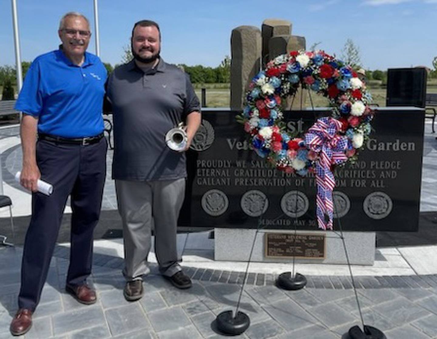 Crest Hill Mayor Ray Soliman (left) and Michael Creasey of Joliet (right) post for a photo at Crest Hill's Memorial Day ceremony on Monday, May 29, 2023, in Crest Hill.  Creasey started playing taps at the annual ceremony when he was 11 years old.