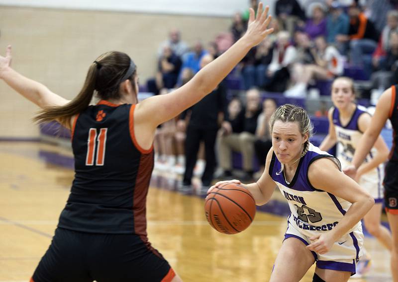 Dixon’s Hannah Steinmeyer drives for the hoop against Byron’s Brittyn Bielskis Tuesday, Jan. 24, 2023.