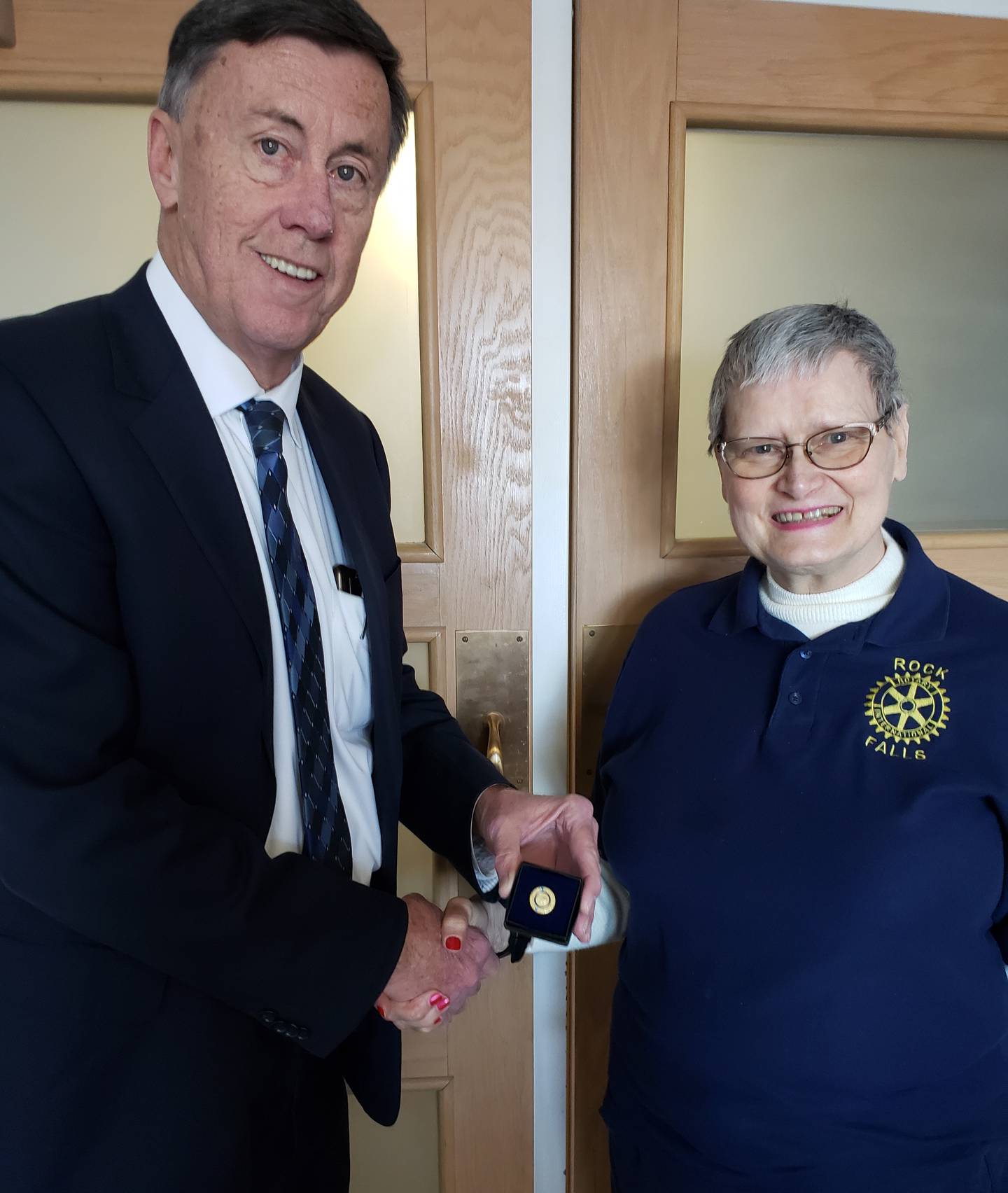 Rock Falls Rotary President Jeff Gray presents Gail Wright with the Paul Harris lapel pin for her donation of over $2,000 to the Rotary Foundation. The pin is awarded is by Rotary Foundation to Rotarians who have supported the Foundation at that level.