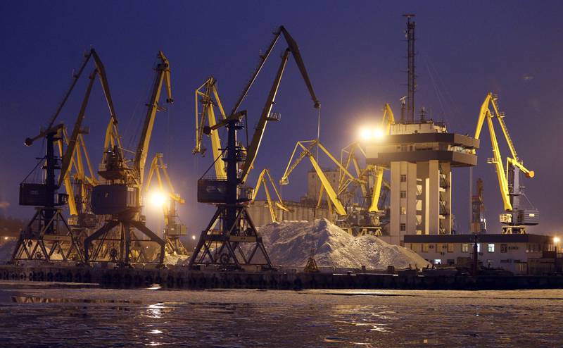 FILE - Harbor cranes are seen in Mariupol trade port in Mariupol, south coast of Azov sea, eastern Ukraine, Sunday, Dec. 2, 2018. Andrey Stavnitser, CEO of the port operator TIS Group said the Black Sea ports are operating as usual for now, but it's only a matter of time before the same insurance problems that cut off commercial flights start to hit the shipping industry. Ukraine is one of the world's top grain exporters, loading container ships that carry 12% of the world's wheat supply and 16% of its corn. (AP Photo/Efrem Lukatsky, File)