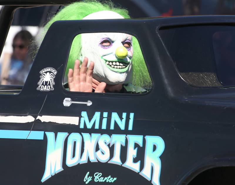 A Nightmare on Fairgrounds Road character rides a mini monster truck during the 52nd annual Homestead Festival parade on Saturday, Sept. 9, 2023 in Princeton.