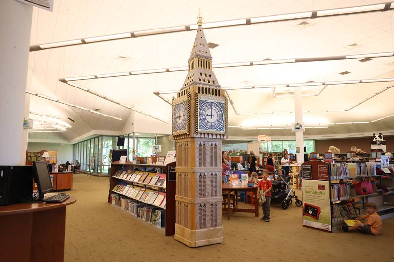 Jan Stack repurposed a bulletin board for the base and hand crafted the top of the Big Ben on display at the Joliet Public Library Black Road Branch for their Travel Through the Pages summer reading program on Thursday May 30, 2024 in Joliet.