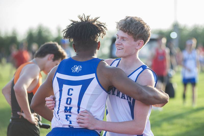 Newman's Marcus Williams (left) and Lucas Simpson celebrate qualifying in the 4x200 at the class 1A Erie track sectionals on Thursday, May 19, 2022.