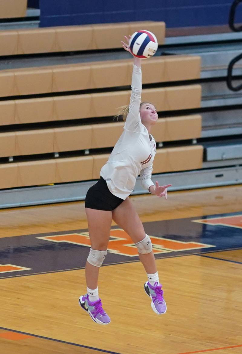 Lincoln-Way West's Laney Tuttle (11) serves the ball against Joliet West during a class 4A Oswego Sectional semifinal match at Oswego High School on Monday, Oct. 30, 2023.