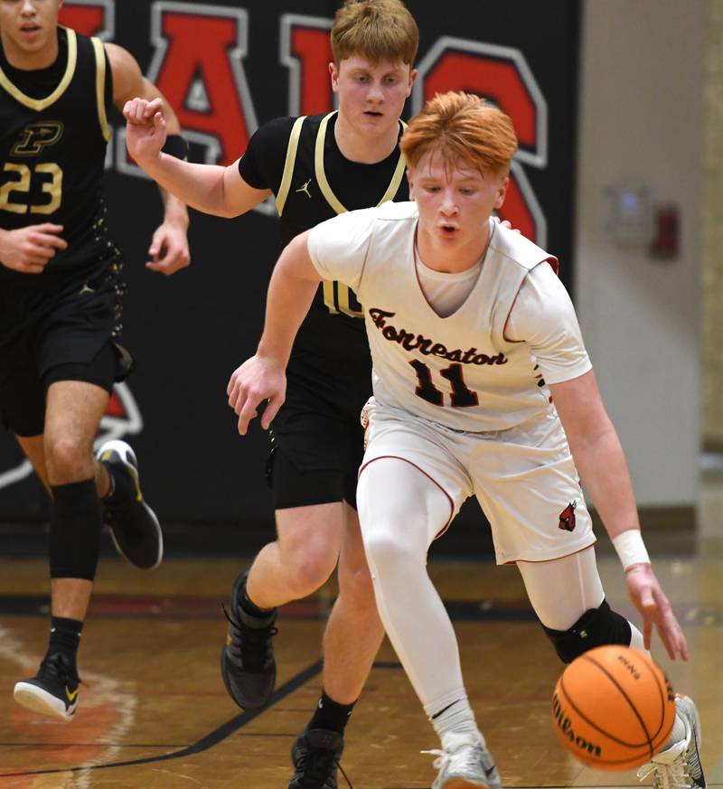 Forreston's Connor Politsch dribbles against Pecatonica in a NUIC matchup at Forreston High School on Wednesday, Feb. 11, 2026.