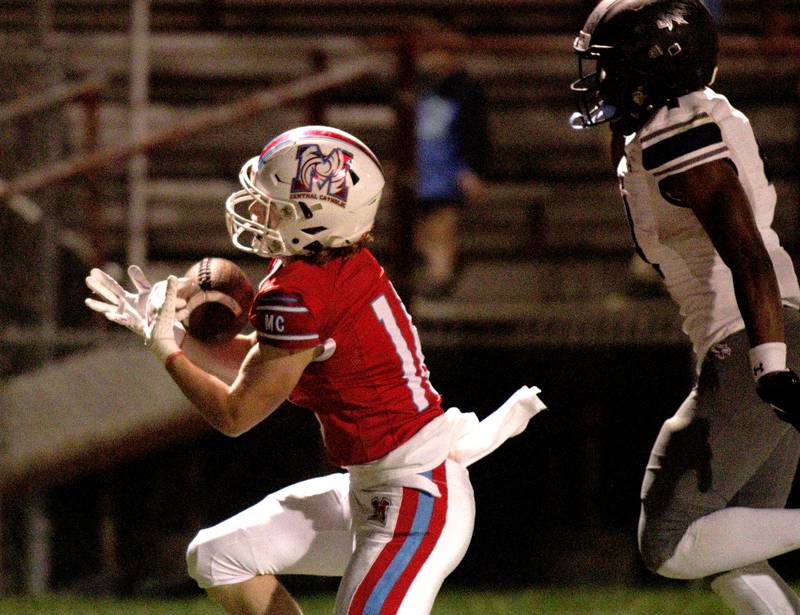 Marian Central’s Jacob Sievert hauls in a reception against Chicago Hope in varsity football at Woodstock Friday night.