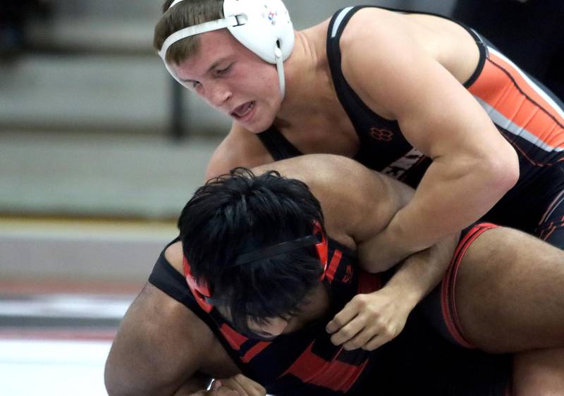 McHenry’s Chris Moore (top) controls Huntley’s Aadi Patel at 170 pounds in their Fox Valley Conference dual on Friday in Huntley.