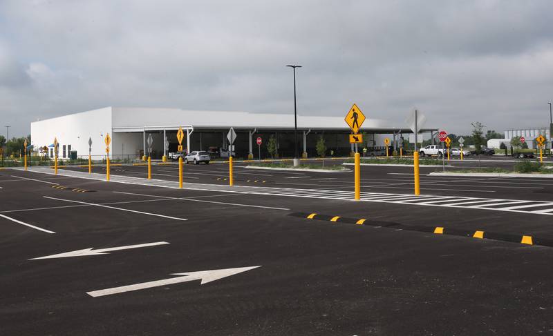 Crews have nearly completed the exterior portion of the Amazon last-mile delivery facility on Wednesday, July 9, 2025, at the Ottawa Industrial Park. Amazon signage is being assembled along with new landscaping. The 50,800-square-foot warehouse will be an addition to Amazon's regional logistics network, helping streamline package delivery to residents and businesses across the region.