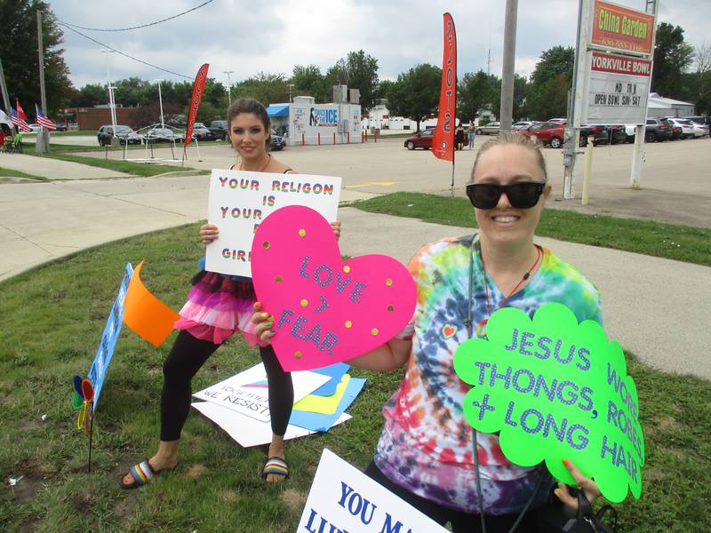 Ashley Quiles, right, and Becky Hofner, both of Plano, demonstrate support for the drag show at Yorkville's Pinz Entertainment Center on Aug. 21, 2022.