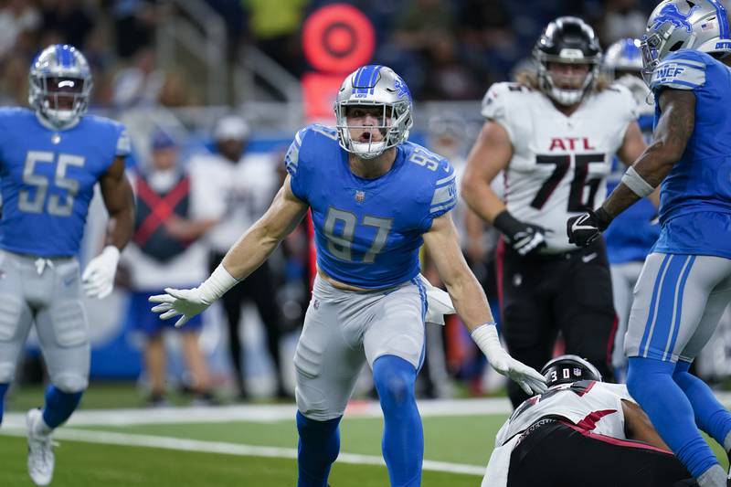 Detroit Lions defensive end Aidan Hutchinson (97) reacts to a tackle for loss against the Atlanta Falcons during a preseason NFL football game in Detroit, Friday, Aug. 12, 2022. (AP Photo/Paul Sancya)