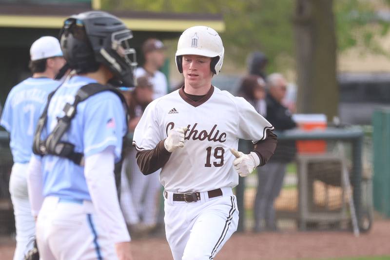 Joliet Catholic’s Nikki Koontz scores on a Koen Lynes triple against Nazareth on Wednesday, April 29, 2026 in Joliet.