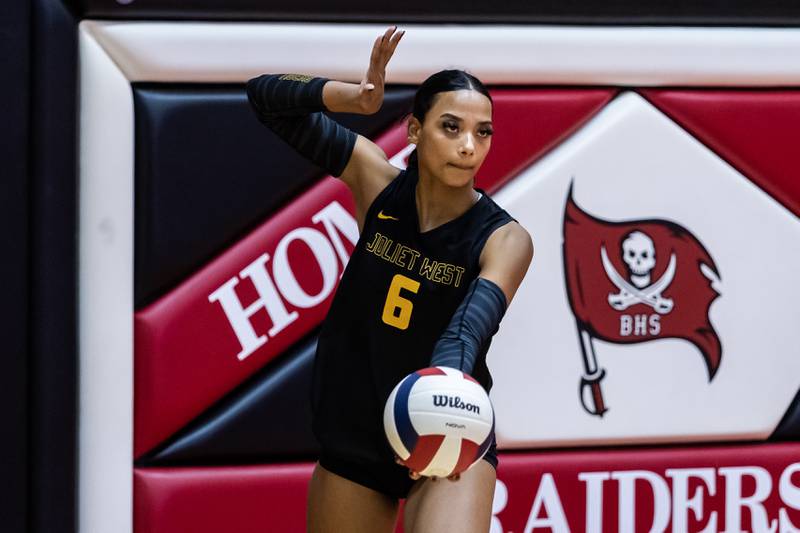 Joliet West's Faith Jordan serves during a varsity volleyball game against Bolingbrook at Bolingbrook on Oct. 16, 2025.