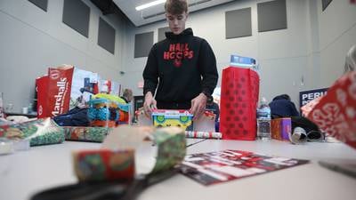 Photos: Volunteers wrap gifts for Blue and Red Christmas for Kids in Peru